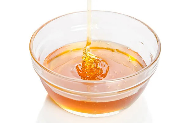 Amber Lactulose Concentrate syrup showing its viscous liquid form.